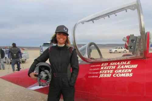 World's Fastest Woman on Four Wheels Jessi Combs stands beside the Landspeed Challenger.